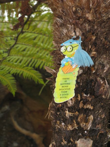 A praying mantis eating a lizard