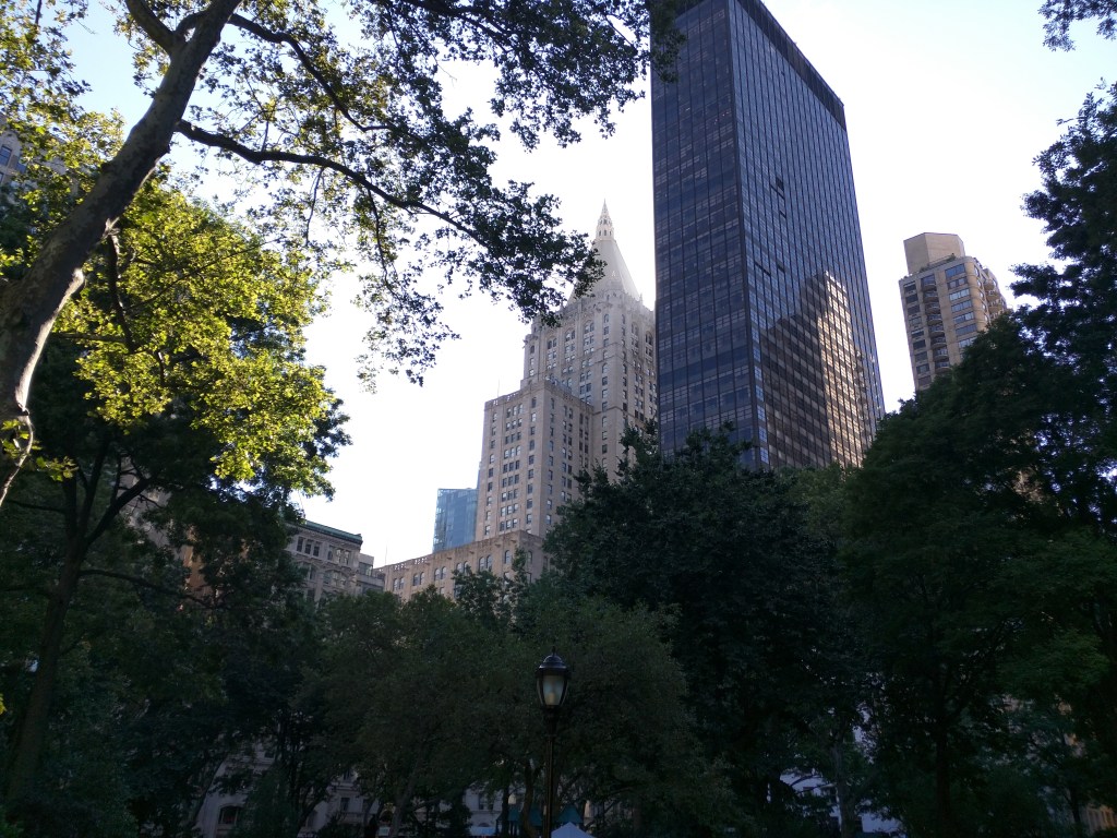 Skyscrapers looming over Madison Square Park